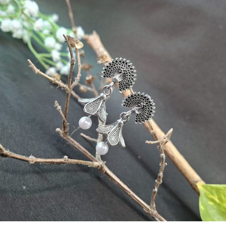 Elegant peacock flower pearl earrings with delicate detailing