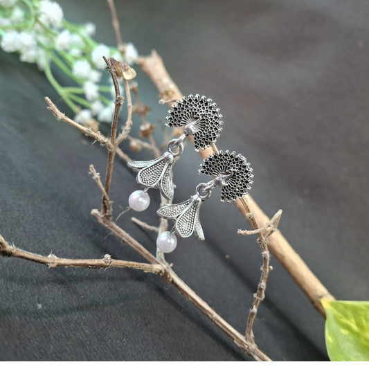 Elegant peacock flower pearl earrings with delicate detailing