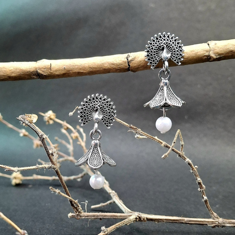 Elegant peacock flower pearl earrings with delicate detailing