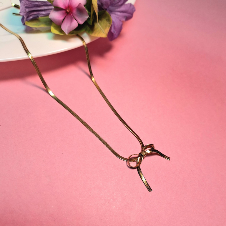 Snake chain necklace with stylish bow knot accent