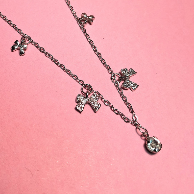 Bow and solitaire pendant necklace for elegant feminine wear