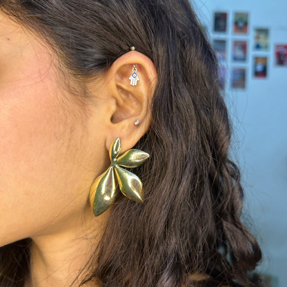 Leaf-shaped gold metal earrings with nature-inspired elegance
