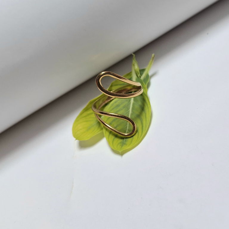 Hollow drop shaped ring with clean, simple design