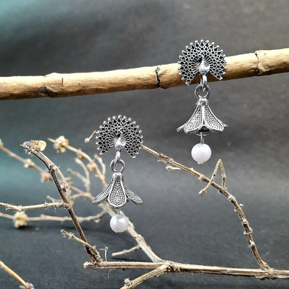 Elegant peacock flower pearl earrings with delicate detailing