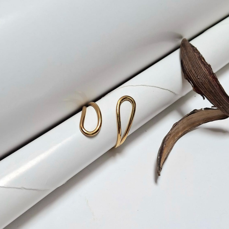 Hollow drop shaped ring with clean, simple design