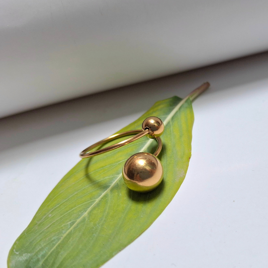 	Ball hoop ring with sleek modern styling